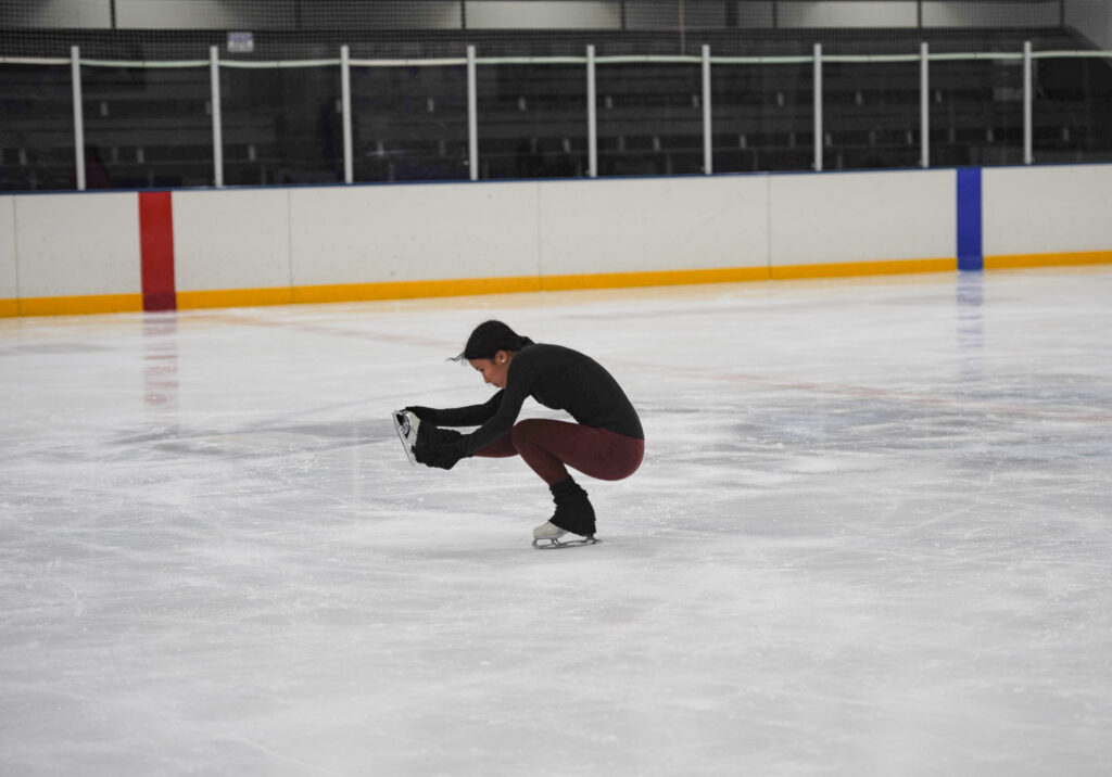 INTRICACY ON ICE Ashley Wang ‘26 utilizes Hatfield Ice Arena’s freestyle skating time to practice her figure skating skills. Photo by Nina Sager ‘26. 