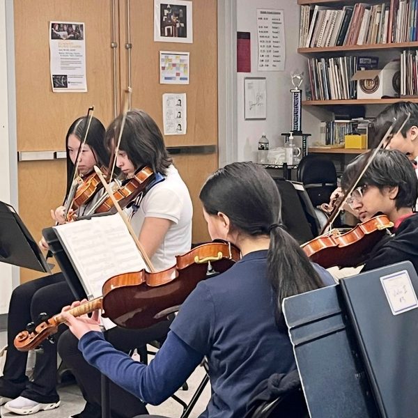Orchestra Prepares for Luncheon Trip Performance  